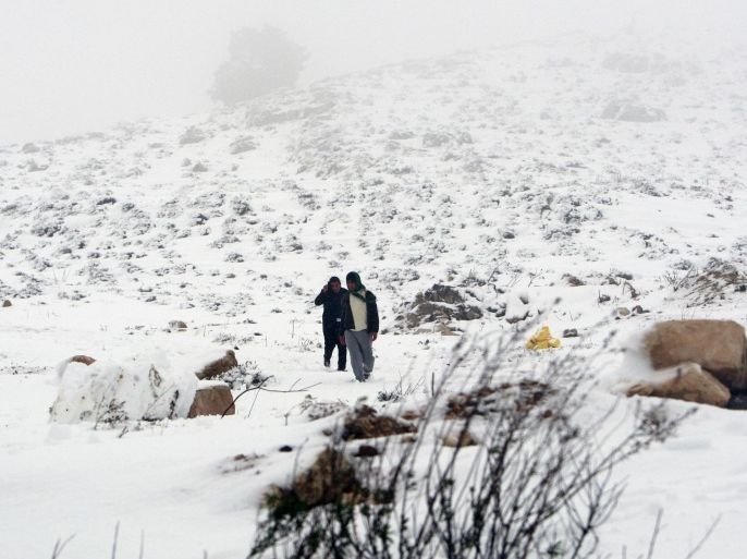 Palestinians play with the snow in the West Bank village of Seelat Al-Daher near Jenin city, Friday, Dec. 13, 2013. Early snow has surprised many Israelis and Palestinians as a blustery storm, dubbed Alexa, brought gusty winds, torrential rains and heavy snowfall to parts of the Middle East. (AP Photo/Mohammed Ballas)