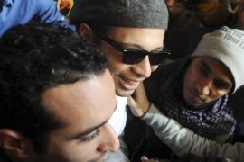 Ahmed Doma (L) and Mohamed Adel (2nd R) are seen with Ahmed Maher (C), founder and former leader of the "April 6" movement, when Maher turned himself in at Abddein court in Cairo, November 30, 2013. Egypt ordered on Thursday three prominent political activists to stand trial on protest-related charges, judicial officials said, in another sign of growing intolerance of dissent. One of them, leading dissident Ahmed Maher, was charged with protesting without permission, marking the first time anyone had been ordered to stand trial under the provisions of a new law criticised for stifling the right to protest. Those charges were also made against Ahmed Douma and Mohamed Adel. Picture taken November 30, 2013. REUTERS/Stringer (EGYPT - Tags: POLITICS CIVIL UNREST CRIME LAW)