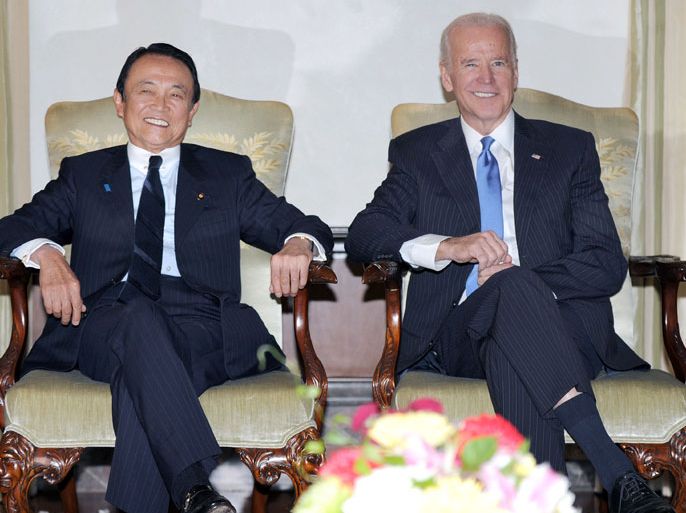 JAPAN : US Vice President Joe Biden (R) shares a light moment with Japanese Deputy Prime Minister and Finance Minister Taro Aso (L) during their meeting at the US ambassador's residence in Tokyo on December, 2013. Biden is in Japan on the first leg of his Asian tour