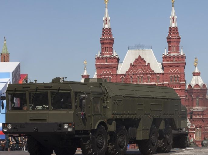 FILE - In this Tuesday, May 7, 2013 file photo, Russian Iskander missiles make their way through Red Square during a rehearsal for the Victory Day military parade in Moscow, Russia. Russia’s Defense Ministry said Monday Dec. 16, 2013, that deployment of Iskander missiles in western part of the country doesn’t violate any international agreements. (AP Photo/Alexander Zemlianichenko, File)