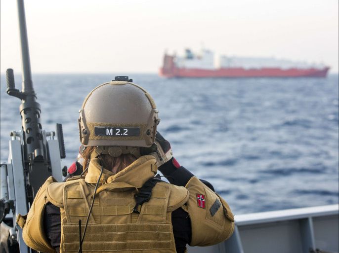 A handout picture taken on December 29, 2013, and released by Norwegian Armed Forces, shows a Norwegian officer on deck watching the cargo vessel "Taiko", earmarked to transport chemical agents from war torn Syria. Four Danish and Norwegian vessels are in the Mediterranean sea waiting for the final order to head to Syria to help in the removal of chemical weapons. The year-end deadline was the first key milestone under a UN Security Council-backed deal arranged by Russia and the United States that aims to wipe out all of Syria's chemical arms by the middle of 2014. AFP PHOTO/Lars Magne Hovtun/NORWEGIAN ARMED FORCES