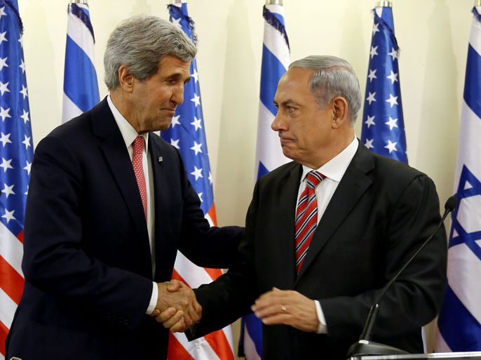 epa03977578 Israeli Prime Minister Benjamin Netanyahu (R) shakes hands with US Secretary of State John Kerry during a press conference following a meeting at Netanyahu's Jerusalem office 05 December 2013. Kerry insisted that Israel's security was a top priority in talks with Iran on its controversial nuclear programme after an initial deal was signed. EPA/GALI TIBBON / POOL