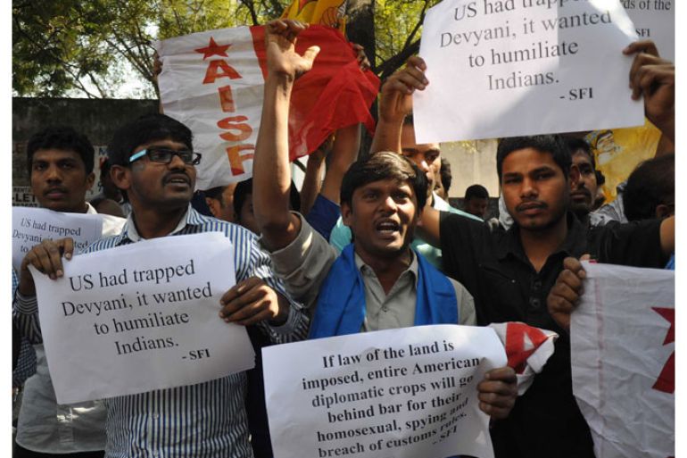 Hyderabad, -, INDIA : Members of The All India Students Federation (AISF) shout slogans and wave placards during a protest in front of the US consulate in Hyderabad on December 19, 2013, following the arrest of New York-based Indian diplomat Devyani Khobragade. India wants to ensure the furore over the arrest and strip-search of a female diplomat in New York does not do lasting harm to its "valuable relationship" with the US, its foreign minister said. AFP PHOTO/STR