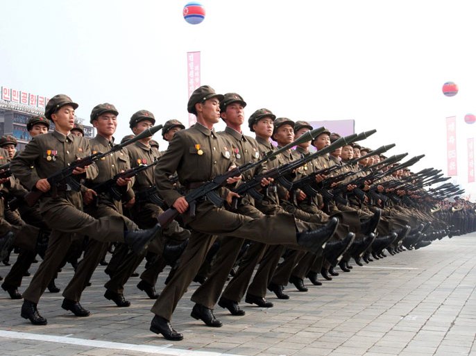 (FILE) North Korean soldiers march in a parade through Kim Il Sung Square celebrating the 65th anniversary of the ruling Korean Workers Party in Pyongyang, North Korea, 10 October 2010. North Korean artillery shells rained down on a South Korean island near their disputed western sea border 23 November 2010, killing two South Korean soldiers and setting forests and dozens of houses ablaze, the Joint Chiefs of Staff in Seoul said. EPA/STF