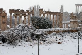 Baalbek's temples are pictured on December 11, 2013 as the Roman ruins of the historic town in eastern Lebanon's Bekaa Valley were covered with snow, following a fierce storm. A winter weather front is forecast to bring several days of rain and snow for the region, and a steep drop in temperature. AFP PHOTO/STR