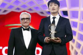 epa03981484 Korean film director Lee Su-Jin (R) holds the Golden Star award for 'Han Su-Jin' next to US writer director Martin Scorsese (L) during the closing ceremony of the 13th annual Marrakech International Film Festival in Marrakech, Morocco, 07 December 2013. The festival runs from 29 November to 07 December. EPA/GUILLAUME HORCAJUELO