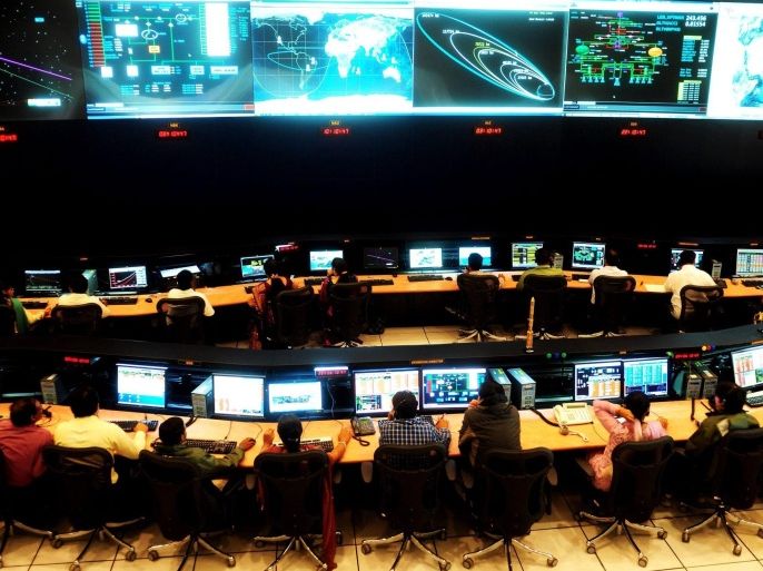 Indian scientists and engineers of Indian Space Research Organization (ISRO) monitor Mars Orbiter Mission (MOM) at the tracking centre, ISTRAC (ISRO Telemetry, Tracking and Command Network.) the Mars Orbiter Mission (MOM) in Bangalore, India on 27 November 2013. India's Mission Mars also called Mangalyaan's ISTRAC will now be the nerve centre of the mission and communicate with the spacecraft, The satellite was going round Earth once in 6 hours 50 minutes in an elliptical orbit of 247 km x 23,564 km between 07 November and 01 December, ISTRAC would progressively stretch one end of the ellipse (at the apogee or farthest point from Earth) in six moves, called orbit raising manoeuvres. The Orbiter Spacecraft, successfully launched from the Satish Dhawan Space Center Sriharikota in Andhra Pradesh, about 80-kilometer from Chennai on 05 November 2013. India as the first Asian nation to reach the red planet.