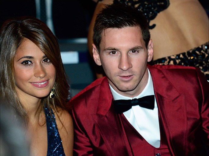 Barcelona's Argentine forward Lionel Messi (R) and his partner Antonella Roccuzzo attend the 2013 FIFA Ballon d'Or award ceremony at the Kongresshaus in Zurich on January 13, 2014. AFP PHOTO / OLIVIER MORIN