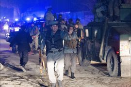 Afghan police arrive at the scene of an explosion in Kabul on January 17, 2014. A large explosion followed by sporadic gunfire rocked central Kabul, in a district that houses several embassies and restaurants frequented by foreigners