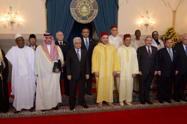 The Moroccan King Mohammed VI (5th from L) poses for a family picture next to Palestinian Authority president Mahmud Abbas (4th from L) at the royal palace during the al-Quds (meaning Jerusalem) Committee Meeting in Support of Middle East Peace Process on January 17, 2014 in Marrakesh. At least 15 representatives from islamic countries are expected to atten this 20th edition that was set up in 1975 to preserve Jerusalem heritage