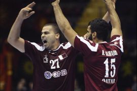 epa03534164 Qatar players Mahmoud Osman (L) and Hamad Alhajri celebrate a goal during their men's Handball World Championship Group B preliminary round match against the Former Yugoslavian Republic of Macedonia (FYROM) at San Pablo sports pavilion in Seville, southern Spain, 13 January 2013