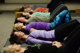 Members of the public participate in a yoga class being taught at the exhibition 'Yoga - The Art of Transformation', at the Smithsonian's Arthur M. Sackler Gallery, in Washington DC, USA, 06 November 2013. A yoga class is now being offered right in the gallery, twice a week, during the exhibition. The exhibition is considered to be the world's first exhibit on the visual history of Yoga and runs through 26 January 2014.