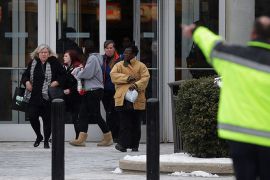 COLUMBIA, MD - JANUARY 25: Police evacuate employees and patrons from the Columbia Town Center Mall after three people were killed in a shooting there January 25, 2014 in Columbia, Maryland. Police still do not have a motive for the shooting but believe the shooter has been killed.
