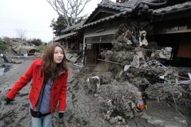 Japan-quake-tsunami-family,FOCUS, by Huw GriffithYoshie Kikuchi visits the site of her parents home in Ishinomaki on March 21, 2011. Standing among the sad ruins of her parents' tsunami-shattered home, Yoshie Kikuchi begins to acknowledge that they probably did not survive the enormous wave that smashed into Japan.