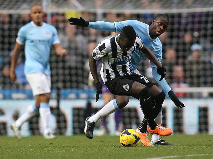Newcastle United's Ivorian midfielder Cheick Tiote (L) vies with Manchester City's Ivorian MidfielderYaya Toure during the English Premier League football match between Newcastle United and Manchester City at St James' Park in Newcastle upon Tyne on January 12, 2014
