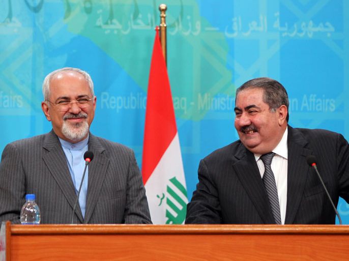 Iraqi Foreign Minister Hoshyar Zebari (R) holds a joint news conference with his Iranian counterpart Mohammad Javad Zarif in Baghdad on January 14, 2014. Zarif who heads to Jordan later in the day and to Moscow on January 16 for talks with Russian President Vladimir Putin on Iran's nuclear programme and on regional issues including Syria, arrived in Iraq from Beirut as part of a regional tour. AFP PHOTO/ALI AL-SAADI