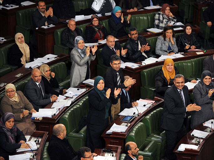 Tunisian Mps applaud during a session at the National Constituent Assembly (NCA) as part of the debates on a new constitution on January 17, 2014,