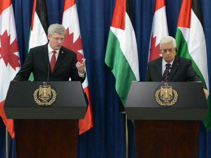 Prime Minister Stephen Harper, left, and Mahmoud Abbas, president of the Palestinian Authority, take part in a joint press conference at Muqa'ata (Presidential Compound) in the West Bank city of Ramallah, Monday, Jan. 20, 2014. While in the Middle East Harper is visiting Israel, the West Bank, and Jordan. (AP Photo/The Canadian Press, Sean Kilpatrick)