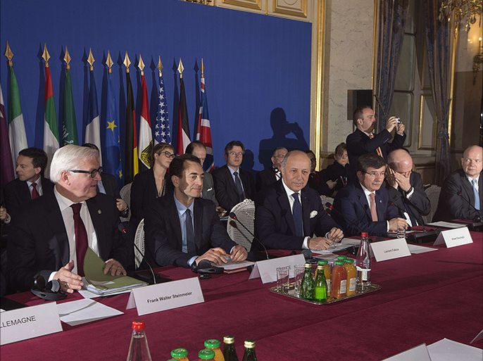 France's Foreign Minister Laurent Fabius (3rdL) presides at the Quai d'Orsay, the French Foreign ministry in Paris on January 12, 2014, the conference of "Friends of Syria". The group meets with leaders of the mainstream opposition to