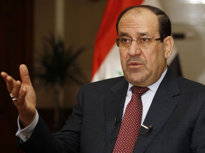 Iraq's Prime Minister Nuri al-Maliki speaks during an interview with Reuters in Baghdad January 12, 2014. Iraqi Prime Minister Nuri al-Maliki threatened on Sunday to cut central government funding for Iraq's autonomous Kurdistan region if the Kurds pursued a drive to pipe oil exports to Turkey without Baghdad's approval. The Kurdistan Regional Government said last week that crude had begun to flow to Turkey and exports were expected to start at the end of this month and then rise in February and March. To match Interview IRAQ-KURDISTAN/OIL REUTERS/Thaier Al-Sudani (IRAQ - Tags: POLITICS ENERGY)