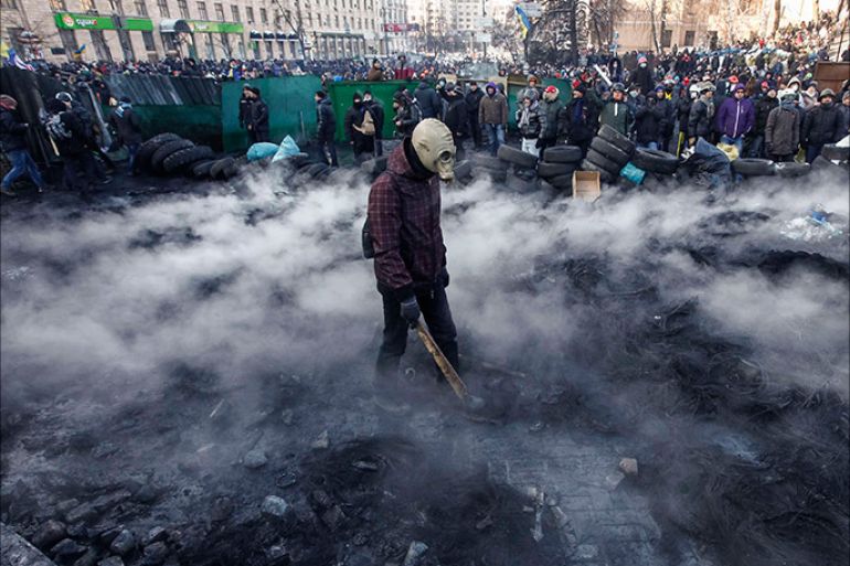 Pro-European integration protesters gather at the site of clashes with riot police in Kiev January 23, 2014. Ukrainian opposition leaders emerged from crisis talks with President Viktor Yanukovich on Wednesday saying he had fa