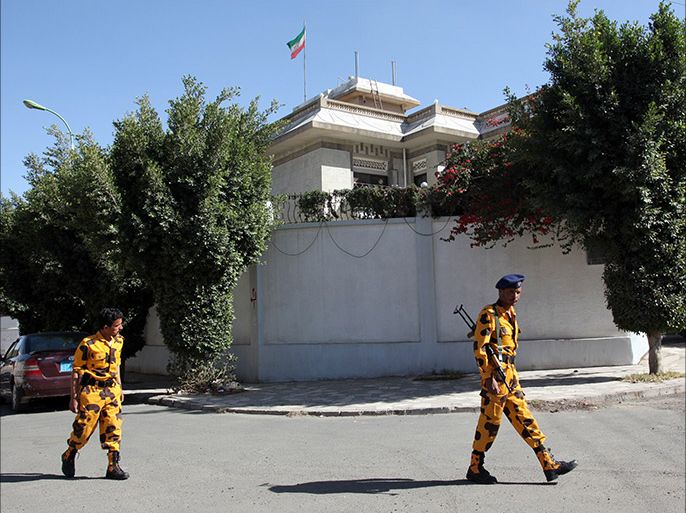 Yemeni soldiers stand guard in front of the Iranian ambassador's residence in Sanaa, on January 18, 2014. Unknown assailants killed an Iranian diplomat in a drive-by shooting outside the ambassador's residenc