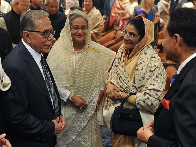 Bangladesh President Abdul Hamid (L), Prime Minister Sheikh Hasina Wajed (2L), opposition leader Raushan Ershad (2R) and Jatiyo Party chairman Hussain Muhammad Ershad chat after Sheikh Hasina Wajed was sworn in for her third term as Bangladesh's prime minister at the Presidential Palace in Dhaka on January 12, 2014. President Abdul Hamid led the oath at the presidential palace in the capital Dhaka in a ceremony broadcast live on television channels, one week after the polls which were condemned by the opposition as a farce. AFP PHOTO