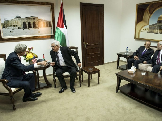 US Secretary of State John Kerry (L) and Palestinian president Mahmud Abbas (2ndL) talk while Palestine Liberation Organization Executive Committee member Yasser Abed Rabbo (2ndR) and Palestinian negotiator Saeb Erekat (R) talk on their side before a meeting at the presidential compound in the West Bank city of Ramallah on January 4, 2014. US Secretary of State John Kerry was seeking to brush aside bitter recriminations from both sides and push forward the Israeli-Palestinian peace talks on a third day of shuttle diplomacy. AFP PHOTO/POOL/BRENDAN SMIALOWSKI