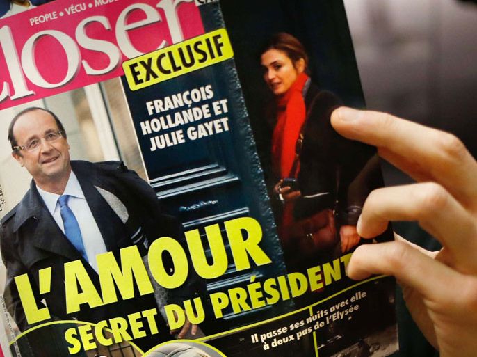 A man reads French magazine Closer, on January 10, 2014 in Paris. Closer said today President Francois Hollande was having an affair with actress Julie Gayet, backing its claim with photographs after months of swirling rumours. AFP
