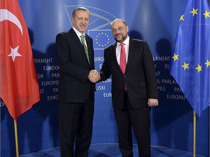 Brussels, -, BELGIUM : Turkish Prime Minister Recep Tayyip Erdogan (L) shakes hands with European Parliament President Martin Schulz (R) prior to their meeting at the European Parliament in Brussels on January 21, 2014. AFP PHOTO / THIERRY CHARLIER