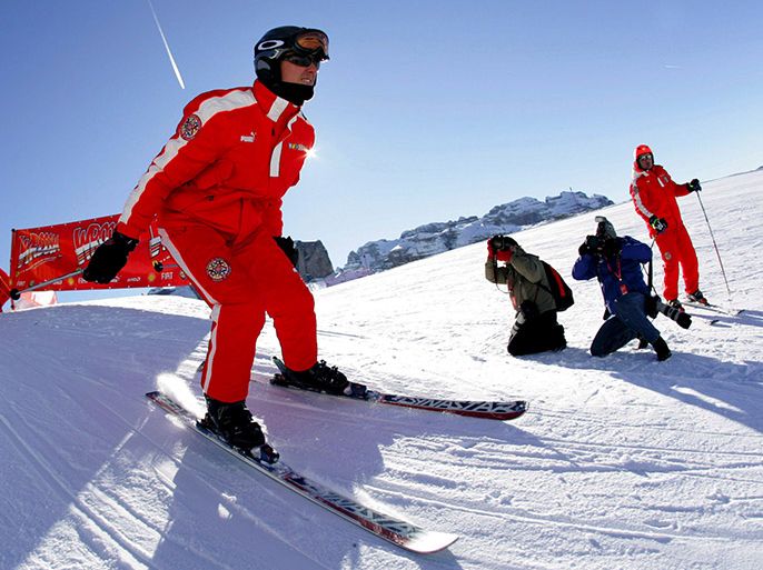 epa04003073 (FILE) A file picture dated 12 JAnuary 2006 shows German then Formula One driver Michael Schumacher getting into carving position as he takes part in a 'Giant Slalom Ski Race' in Madonna di Campiglio, Italy. According to reports, Michael Schumacher on 29 December 2013 has suffered serious head injuries while skiing in Meribel, France. EPA/RAINER JENSEN