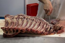 In this photo taken on Tuesday, April.9, 2013, Butcher Manuel Delgado prepares a piece of a ''Pura Raza Espanola'' or Pure Spanish Breed horse meat in a horse meat butcher in Camas, Spain. The southern Spanish region of Andalusia, famed for flamenco and Moorish castles, is also home to a legendary breed of horses that carried conquistadors into battle in the Americas, featured in Hollywood epics and more recently became trophy acquisitions for Spaniards during a giddy economic boom. Now, they are victims of a wrenching economic downturn that has wiped out fortunes, turned housing developments into ghost towns and left more than a quarter of the population out of work. (AP Photo/Laura Leon)