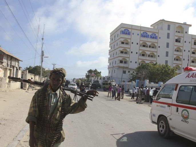 (FILE) A file photo dated 12 September 2012 shows a Somali soldier in front of Jazeera Hotel in Mogadishu, Somalia, after two explosions rocked the hotel while the country's president Hassan Sheikh Mohamud and the Kenyan foreign minister Samson Ongeri were holding a meeting. According to media reports on 01 January 2014, two car bombs exploded outside the Jazeera Hotel late 01 January, killing at least 8 people. The blasts were followed by exchanges of heavy gunfire between the security forces and attackers, reports say. The al-Qaeda-linked Islamist militant group al-Shabab has claimed responsibility for the attack.