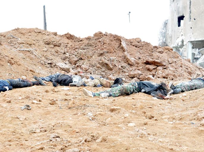 A handout picture released by the official Syrian Arab News Agency (SANA) on January 26, 2014 shows bodies of rebel fighters laying on the ground after they were allegedly killed by Syrian government forces in the al-Qadam neighbourhood of the Syrian capital Damascus. Syria's air force struck rebel-held areas around Damascus and Aleppo on January 25, the Syrian Observatory for Human Rights said, as face-to-face peace talks tentatively began in Switzerland. AFP PHOTO / HO / SANA === RESTRICTED TO EDITORIAL USE - MANDATORY CREDIT "AFP PHOTO / HO / SANA" - NO MARKETING NO ADVERTISING CAMPAIGNS - DISTRIBUTED AS A SERVICE TO CLIENTS ===