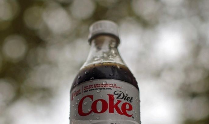 A bottle of Diet Coke soft drink is seen in Arlington, Virginia, August 17, 2009. Coca-Cola Co's shares are set to rise as much as 20 percent, Barron's said in its August 17 edition, pointing to the soft-drink maker's cost cutting, position in fast-growing emerging markets and new arrangements with its bottlers. Coca-Cola has used its ample cash during the economic downturn to take market share from rivals.