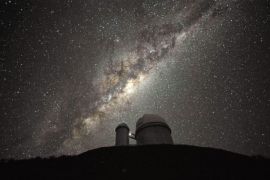 A undated handout image made available by European Southern Observatory, ESO, 12 September 2013, showing the ESO 3.6-metre telescope at La Silla, during observations. The Milky Way, our own galaxy, stretches across the picture: it is a disc-shaped structure seen perfectly edge-on. Above the telescopeÂ´s dome, here lit by the Moon, and partially hidden behind dark dust clouds, is the yellowish and prominent central bulge of the Milky Way. The whole plane of the galaxy is populated by about a hundred thousand million stars, as well as significant amounts of interstellar gas and dusts. The dust absorbs visible light and reemits it at longer wavelength, appearing totally opaque at our eyes. The ancient Andean civilizations saw in these dark lanes their animal-shaped constellations. By following the dark lane which seems to grow from the centre of the Galaxy toward the top, we find the reddish nebula around Antares (Alpha Scorpii). The Galactic Centre itself lies in the constellation of Sagittarius and reaches its maximum visibility during the austral winter season. The ESO 3.6-metre telescope, inaugurated in 1976, currently operates with the HARPS spectrograph, the most precise exoplanet âhunterâ in the world. Located 600 km north of Santiago, at 2400 metres altitude in the outskirts of the Chilean Atacama Desert, La Silla was first ESO site in Chile and the largest observatory of its time. EPA/ESO / SERGE BRUNIER