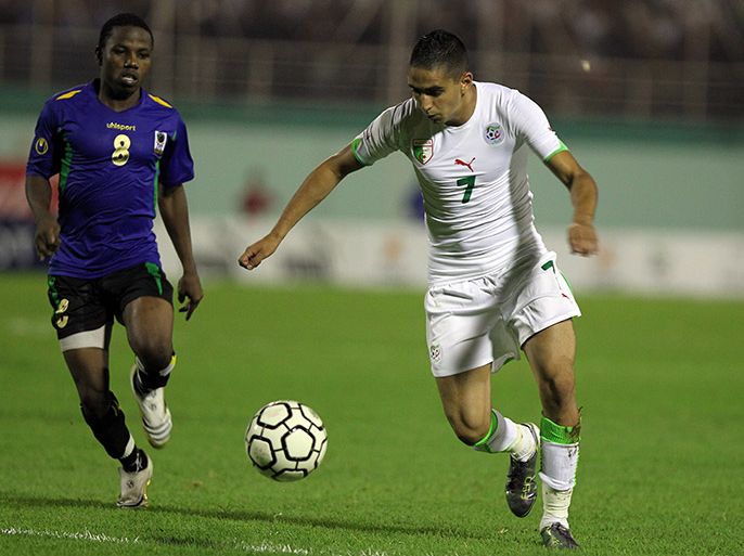 epa02315758 Algerian player Ryad Boudebouz (R ) fights for the ball with Tanzania player Ngasa Mrisho (L) during their Africa 2012 qualifying soccer match inat the Mustapha Tchaker Stadium in Blida 50 Km South of Algiers, Algeria on 03 September 2010. EPA
