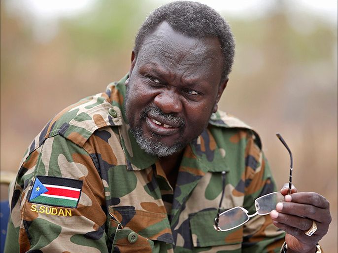 South Sudan's rebel leader Riek Machar speaks to rebel General Peter Gatdet Yaka (not seen) in a rebel controlled territory in Jonglei State February 1, 2014.