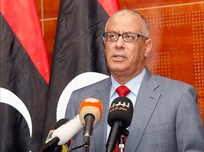 Libya's Prime Minister Ali Zeidan speaks during a news conference in Tripoli February 7, 2014. Zeidan appealed for Libyans to avoid violence in settling a standoff over their interim parliament, whose mandate was due to run out on Friday with the country deeply divided over its future. REUTERS/Ismail Zitouny (LIBYA - Tags: POLITICS CIVIL UNREST)