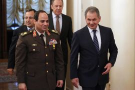 Egypt’s military chief Field Marshal Abdel-Fattah el-Sissi, second left, and Egyptian Foreign Minister Nabil Fahmy, left, are escorted by Russian Defense Minister Sergei Shoigu, right, and Russian Foreign Minister Sergey Lavrov as they enter a hall for their two-plus-two talks in Moscow, Russia, Thursday, Feb. 13, 2014. Egypt’s military chief visits Russia on his first trip abroad since ousting the Islamist president, part of a shift to reduce reliance on the United States at a time of frictions between the longtime allies. (AP Photo/Alexander Zemlianichenko)