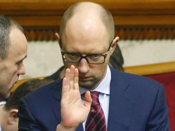 Arseniy Yatsenyuk, leader of the Ukrainian 'Batkivshchyna' (Fatherland) party, gestures while spaking with a delegateduring a parliament session in Kiev, Ukraine, 27 February 2014. Ukraine warned Russia to keep its armed forces on the Crimea peninsula inside their bases, after pro-Russian self defence forces seized regional government buildings. Any troop movements outside their agreed territory will be considered 'military aggression,' acting Ukrainian President Oleksandr Turchynov told the parliament. The Ukrainian parliament was due to appoint Arseniy Yatsenyuk, a key figure in the protests that led to the ousting of president Viktor Yanukovych, as interim prime minister on 27 February.
