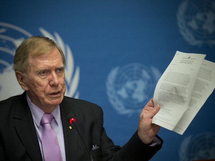 Retired Australian judge Michael Kirby, chairperson of the commission of Inquiry on Human Rights in the Democratic People's Republic of Korea, shows a UN letter to North Korean leader warning on-accountability for 'crimes during a press conference at the United Nations in Geneva, Switzerland, Monday, Feb. 17, 2014. A U.N. panel has warned North Korean leader Kim Jong Un that he may be held accountable for orchestrating widespread crimes against civilians in the secretive Asian nation. Kirby told the leader in a letter accompanying a yearlong investigative report on North Korea that international prosecution is needed "to render accountable all those, including possibly yourself, who may be responsible for crimes against humanity." (AP Photo/Anja Niedringhaus)
