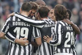 Juventus' Spanish forward Fernando Llorente (2ndL-back) celebrates with teammates after scoring a goal during the Italian Serie A football match Juventus vs Chievo Verona at the Juventus Stadium in Turin on February 16, 2014