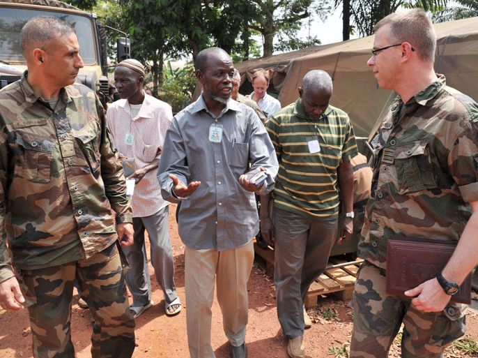 Bangui, -, CENTRAL AFRICAN REPUBLIC : French Sangaris' forces Commander general Francisco Soriano (L) and colonel Thierry Mollard (R), spokesman for the Sangaris operationspeak with Central African Republic Islamic community chairman imam Oumar Kobine Layama (C) after their meeting at the Sangaris heardquarters in Bangui on Febuary 4, 2014.The violence in Central Africa has been "partly halted", the head of the French army said on February 03, 2014, even as reports emerged that at least 75 people had been killed in a single town AFP PHOTO/ ISSOUF SANOGO