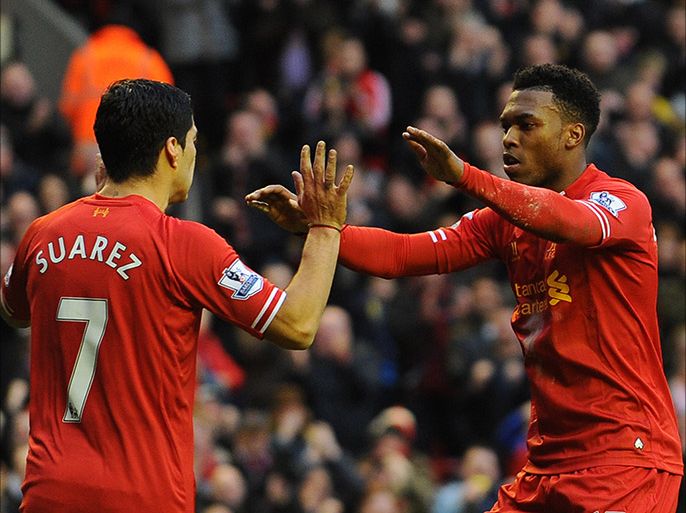 Liverpool's English striker Daniel Sturridge (R) celebrates scoring his team's third goal with Liverpool's Uruguayan striker Luis Suarez (L) during the English Premier League football match between Liverpool and Swansea City at Anfield in Liverpool, northwest England on February 23, 2014