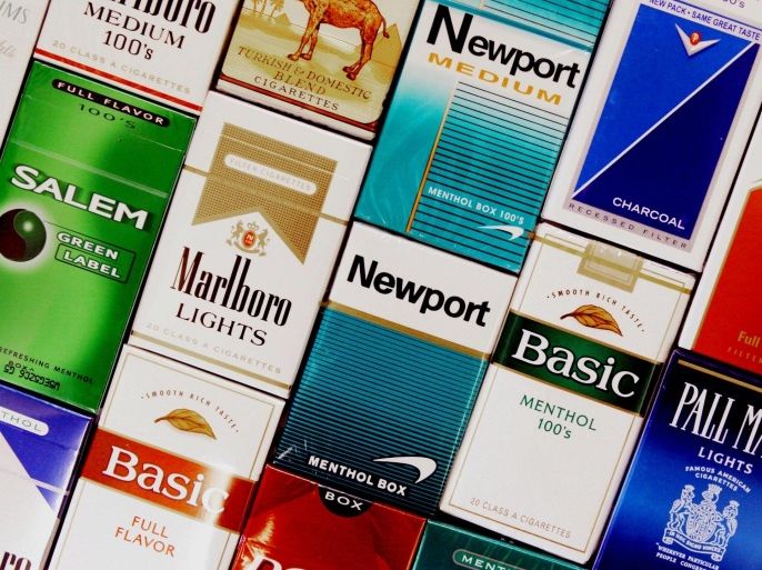 FILE - This Sept. 14, 2005 file photo shows packs of cigarettes in a store in Brunswick, Maine. It's no secret that smoking causes lung cancer. But what about diabetes, rheumatoid arthritis, erectile dysfunction? Fifty years into the war on smoking, scientists still are adding diseases to the long list of cigarettes' harms _ even as the government struggles to get more people to kick the habit. A new report from the U.S. Surgeon General's office says the nation is at a crossroads, celebrating decades of progress against the chief preventable killer but not yet poised to finish the job. (AP Photo/Pat Wellenbach, File)
