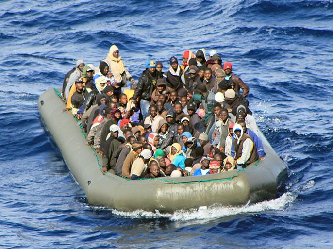 epa04058247 A handout video-grab released by Italian Navy Press Office on 06 February 2014 shows a boat with African migrants on board spotted by the Navy at sea near Lampedusa, Italy, 05 February 2014. Some 1,000 migrants aboard nine boats have been rescued by the Italian coast over the past days. The boats had left North Africa and were heading to the Italian island