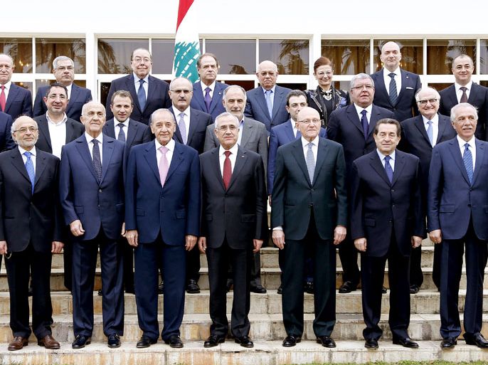 epa04079187 A handout picture made available by Lebanese official photos agency Dalati Nohra shows Lebanese President Michel Sleiman (C, front row) posing for a group photo with Parliament Speaker Nabih Berri (4-L, front row) and Prime Minister-designate Tammam Salam (4-R, front row) and members of the new government at the presidential palace in Baabda, east Beirut, Lebanon, 15 February 2014.Salam ended a 10-month vacuum on 15 February by forming a national unity cabinet that includes all rival groups, which have been mainly divided over the conflict in neighbouring Syria . EPA/DALATI NOHRA/HANDOUT HANDOUT EDITORIAL USE ONLY/NO SALES