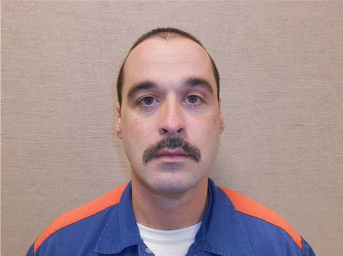 Ionia, Michigan, UNITED STATES : This picture dated February 11, 2013 provided by the Michigan Department of Corrections shows convicted murderer Michael David Elliot. US authorities launched a manhunt on February 3, 2014 for Elliot who escaped jail before kidnapping a terrified a woman and making her drive with him for hours. Elliot, 40, was serving life sentences at a prison in Ionia, Michigan, for the 1993 murders of four people. The mustachioed man with receding brown hair was wearing a blue and orange prison uniform when he escaped on February 2, Michigan State police said. He armed himself with a hammer and box cutter before forcing himself into a woman's red Jeep at 8.00 pm. He made her give him black cargo pants, a white turtleneck and a jacket to change into. AFP PHOTO/MICHIGAN DEPARTMENT OF CORRECTIONS/HO ++RESTRICTED TO EDITORIAL USE - NOT FOR ADVERSTISING OR MARKETING CAMPAIGNS - MANDATORY CREDIT: AFP PHOTO/MICHIGAN DEPARTMENT OF CORRECTIONS - DISTRIBUTED AS A SERVICE TO CLIENTS++