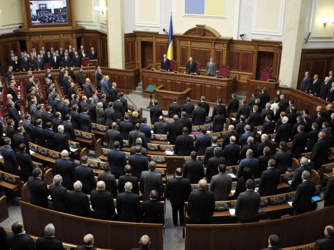 Ukrainian lawmakers open a session in the Ukrainian parliament in Kiev, Ukraine, Tuesday, Feb. 4, 2014. (AP Photo/Sergei Chuzavkov)